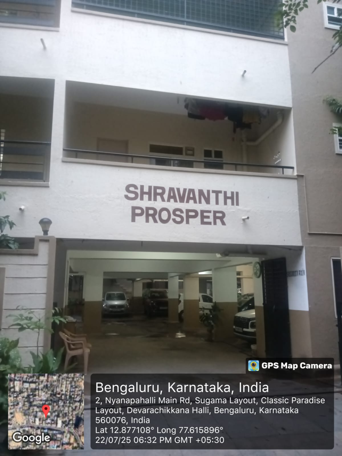 Final GPS stamped photo showing building entrance with coordinates